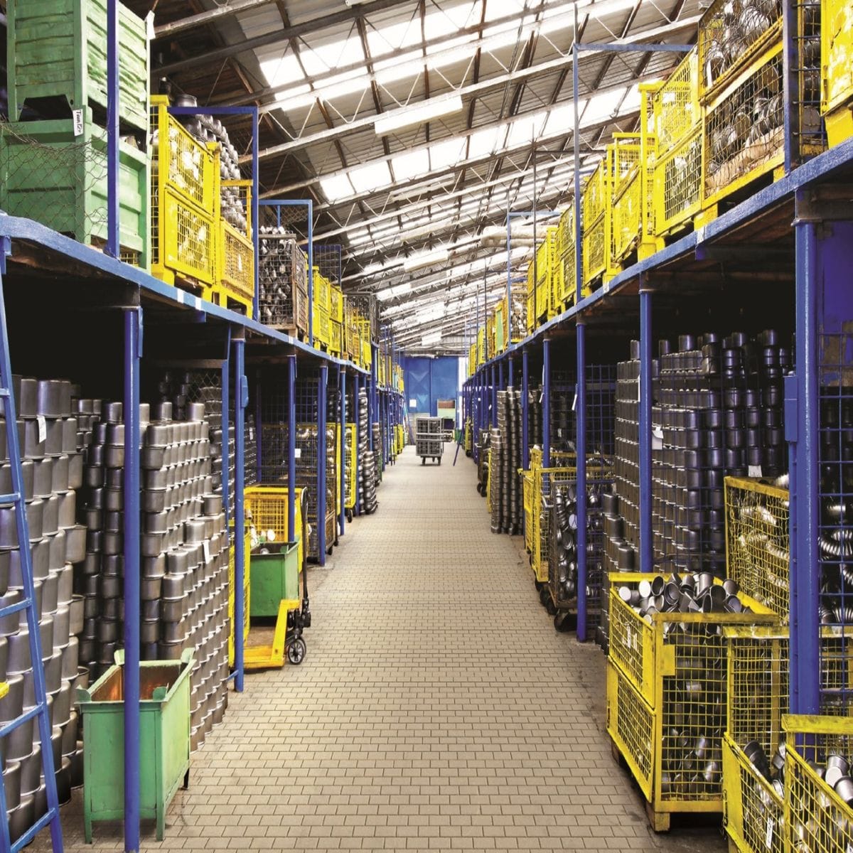Distribution warehouse aisle with stocked racking (illustrative photo)