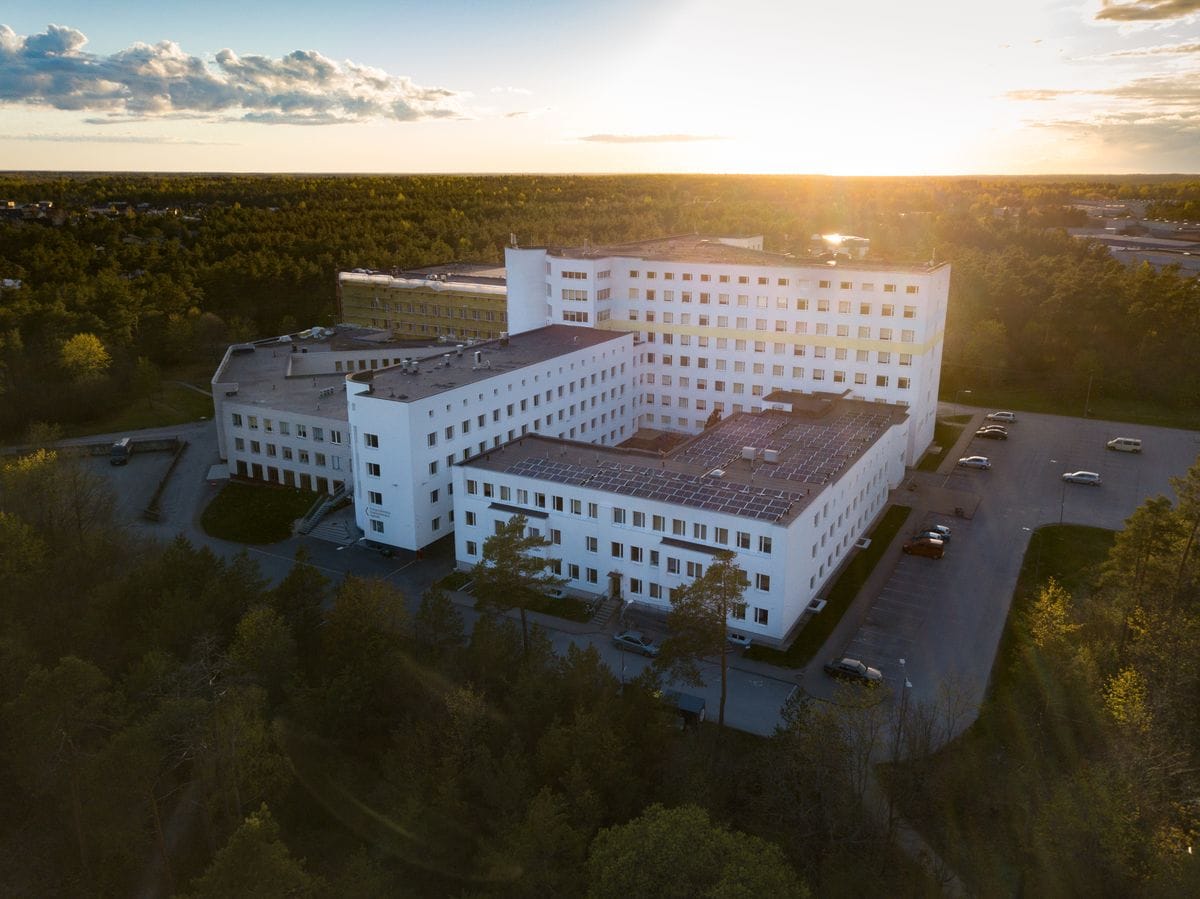 Modern hospital building at sunset, aerial view (illustrative photo)
