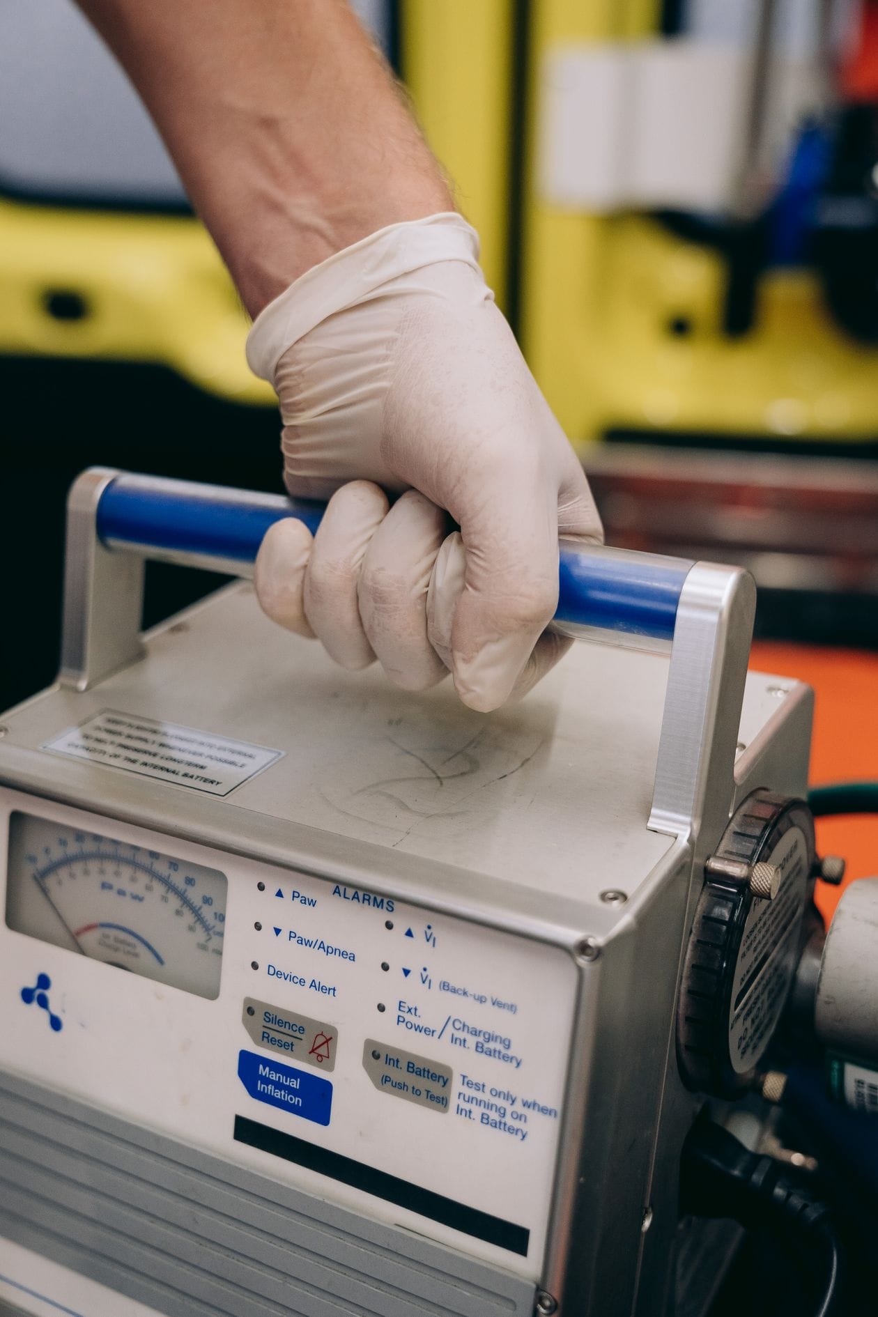 Gloved hand on a medical device (illustrative photo)